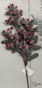 Christmas tree spray with berries and snow
